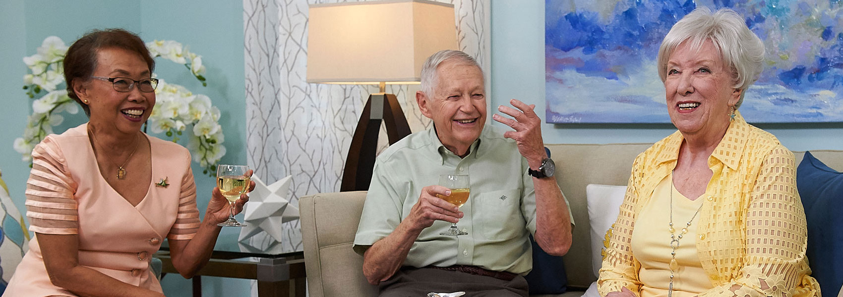 A group of seniors enjoying cocktails during happy hour at their retirement community