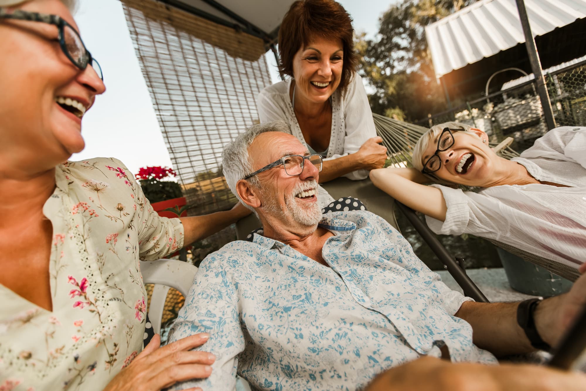 A group of elderly people enjoying their time together under the sun